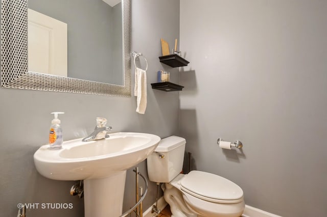 1849 W Newport Ave Unit 1, Chicago, IL 60657 - half bathroom featuring toilet and baseboards