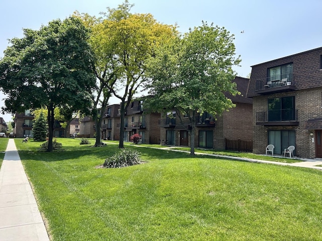 9814 Bianco Ter Unit 1B, Des Plaines, IL 60016 - surrounding community featuring a lawn
