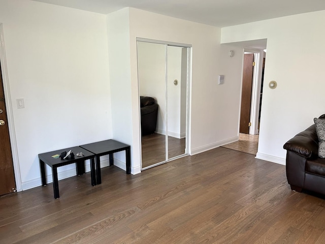 9814 Bianco Ter Unit 1B, Des Plaines, IL 60016 - living area featuring dark wood finished floors and baseboards