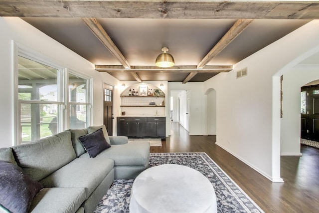 1480 Briar Cv, Wheaton, IL 60189 - living area with arched walkways, dark wood finished floors, baseboards, and beamed ceiling