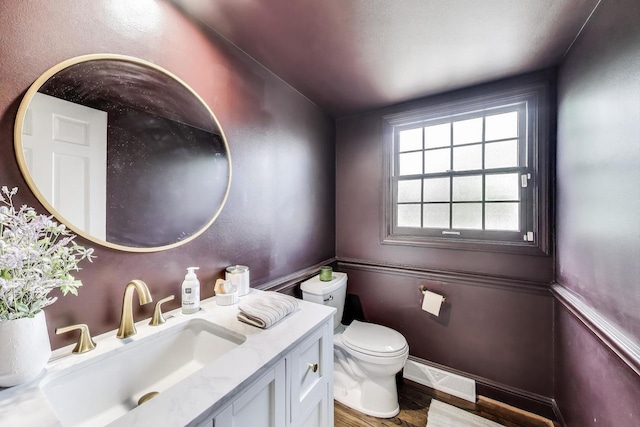 1480 Briar Cv, Wheaton, IL 60189 - half bathroom with vanity, toilet, wood finished floors, and baseboards