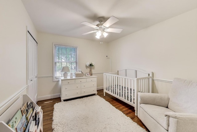 1480 Briar Cv, Wheaton, IL 60189 - bedroom with dark wood-type flooring, ceiling fan, a closet, a crib, and baseboards