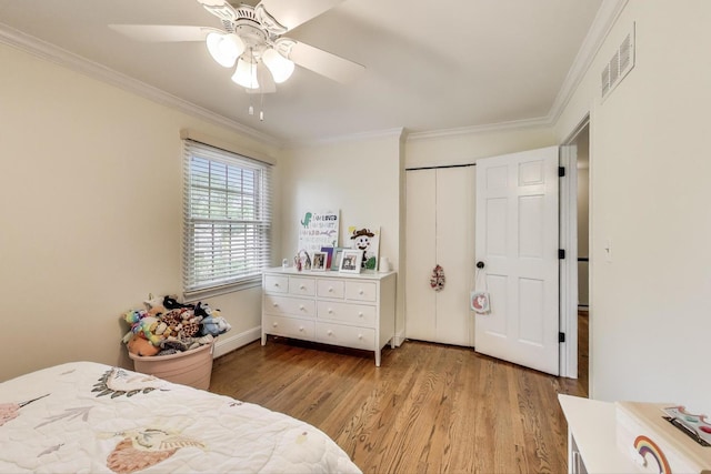1480 Briar Cv, Wheaton, IL 60189 - bedroom featuring ornamental molding, light wood finished floors, ceiling fan, and a closet