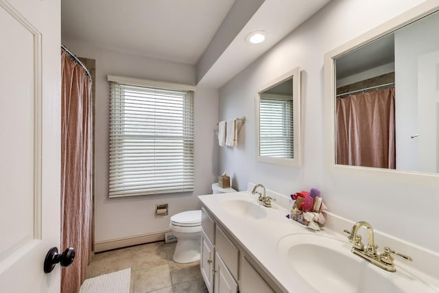 1480 Briar Cv, Wheaton, IL 60189 - full bathroom with double vanity, toilet, tile patterned floors, plenty of natural light, and recessed lighting