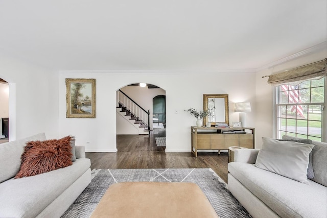1480 Briar Cv, Wheaton, IL 60189 - living area featuring arched walkways, ornamental molding, wood finished floors, baseboards, and stairway
