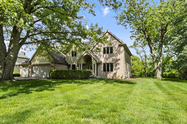 2 Lake Metonga Trl, Grant Park, IL 60940 - view of front of home with a garage, a front yard, and brick siding