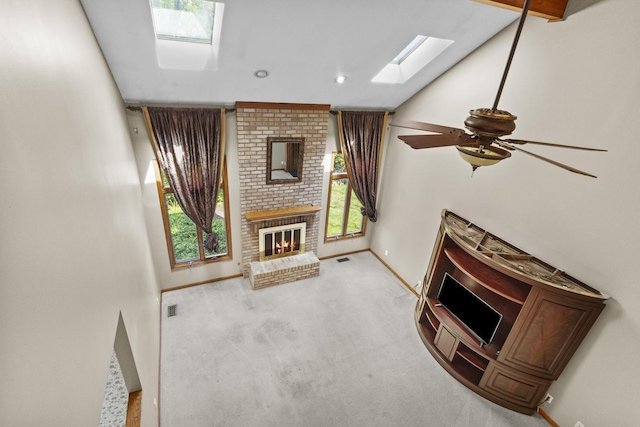2 Lake Metonga Trl, Grant Park, IL 60940 - unfurnished living room featuring a skylight, a fireplace, carpet flooring, ceiling fan, and recessed lighting