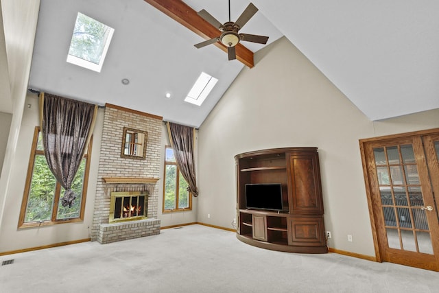 2 Lake Metonga Trl, Grant Park, IL 60940 - unfurnished living room with a skylight, a ceiling fan, high vaulted ceiling, carpet flooring, and a brick fireplace