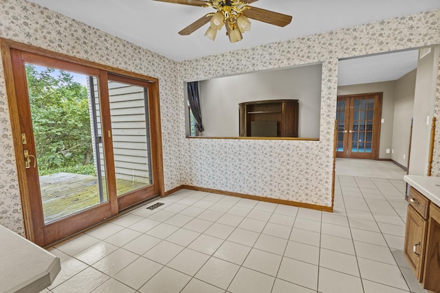 2 Lake Metonga Trl, Grant Park, IL 60940 - unfurnished dining area with wallpapered walls, a ceiling fan, and light tile patterned floors