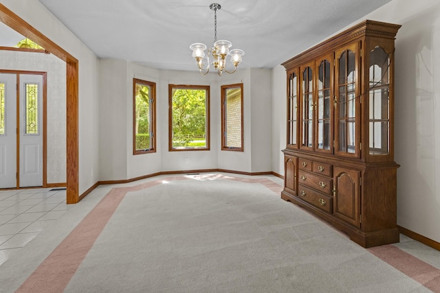 2 Lake Metonga Trl, Grant Park, IL 60940 - unfurnished room featuring light colored carpet, healthy amount of natural light, a chandelier, and light tile patterned floors