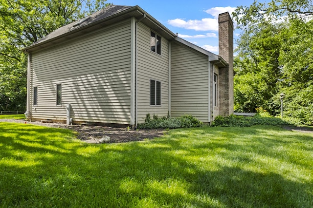 2 Lake Metonga Trl, Grant Park, IL 60940 - view of home's exterior featuring a chimney and a yard