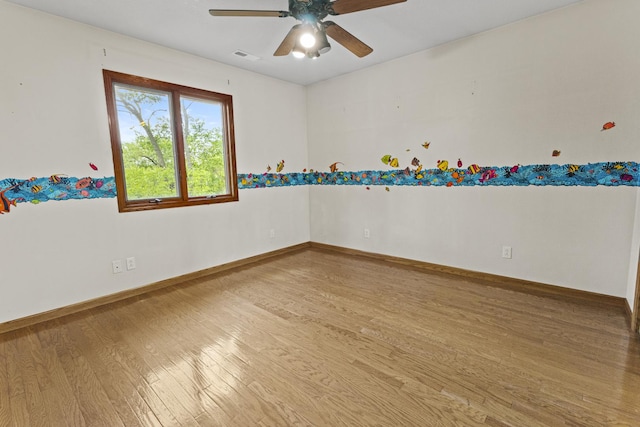2 Lake Metonga Trl, Grant Park, IL 60940 - empty room with wood finished floors and a ceiling fan