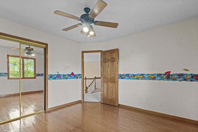 2 Lake Metonga Trl, Grant Park, IL 60940 - unfurnished bedroom with wood finished floors, a closet, and a ceiling fan