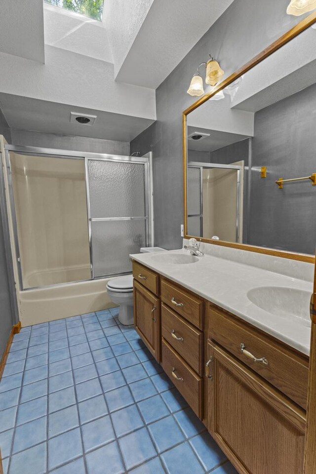 2 Lake Metonga Trl, Grant Park, IL 60940 - full bathroom featuring double vanity, bath / shower combo with glass door, and tile patterned flooring