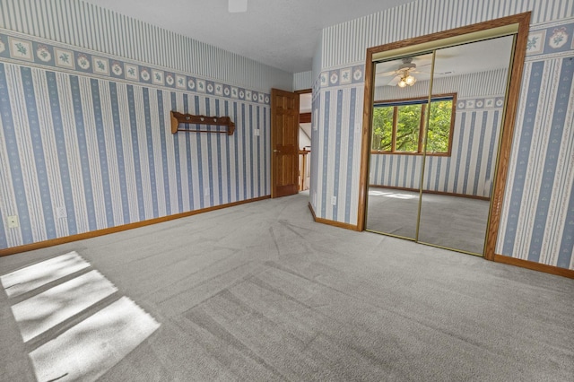 2 Lake Metonga Trl, Grant Park, IL 60940 - carpeted empty room with a ceiling fan and wallpapered walls