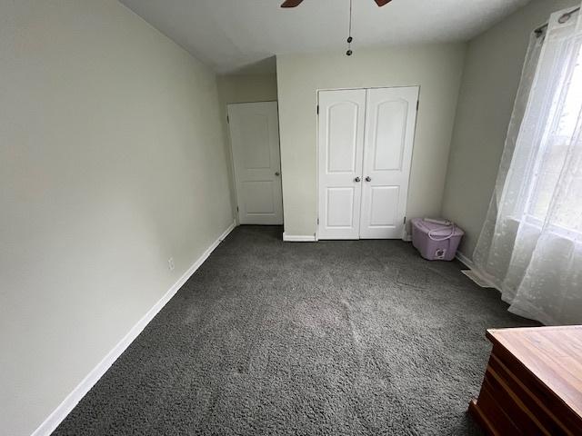 114 Dante Ct, Shorewood, IL 60404 - unfurnished bedroom featuring carpet flooring, multiple windows, and baseboards