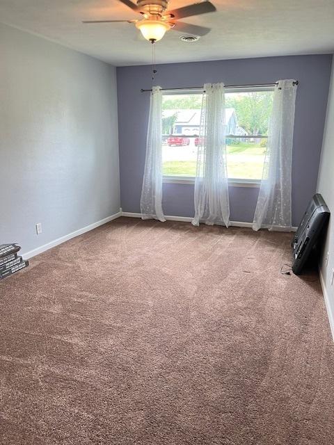 114 Dante Ct, Shorewood, IL 60404 - carpeted empty room with a ceiling fan and baseboards