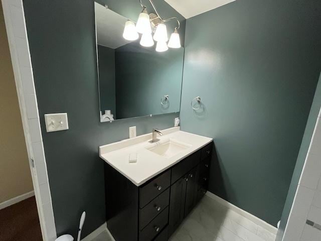 114 Dante Ct, Shorewood, IL 60404 - bathroom featuring vanity, a chandelier, and baseboards