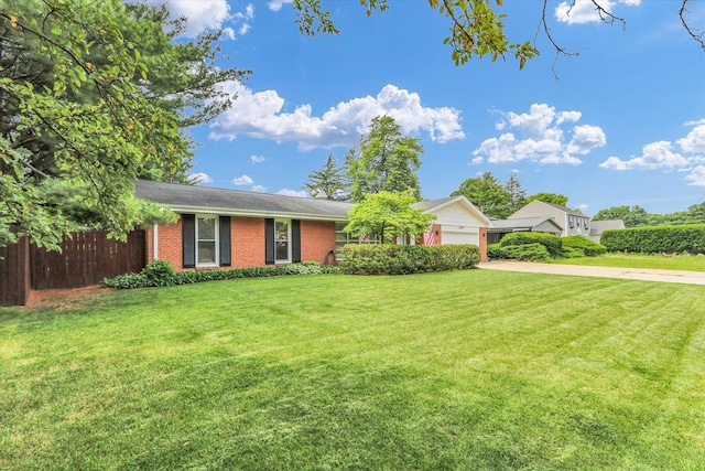 1207 W Kirby Ave, Champaign, IL 61821 - ranch-style house with driveway, brick siding, and an attached garage