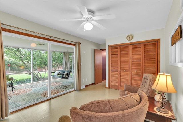 1207 W Kirby Ave, Champaign, IL 61821 - living area with plenty of natural light, ceiling fan, and tile patterned floors