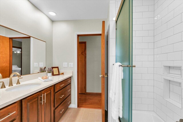 1207 W Kirby Ave, Champaign, IL 61821 - bathroom featuring vanity and combined bath / shower with glass door
