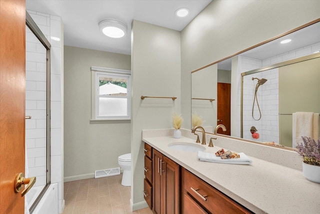 1207 W Kirby Ave, Champaign, IL 61821 - full bathroom featuring vanity, tile patterned floors, and bath / shower combo with glass door