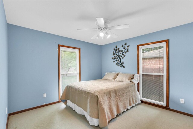 1207 W Kirby Ave, Champaign, IL 61821 - carpeted bedroom featuring multiple windows and ceiling fan