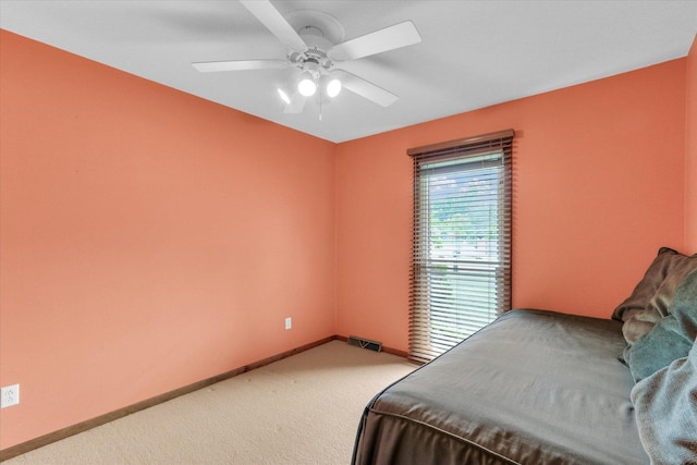 1207 W Kirby Ave, Champaign, IL 61821 - bedroom featuring light carpet and ceiling fan