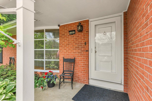1207 W Kirby Ave, Champaign, IL 61821 - property entrance with brick siding and covered porch