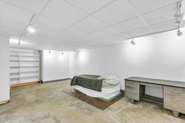1207 W Kirby Ave, Champaign, IL 61821 - bedroom featuring rail lighting and unfinished concrete flooring