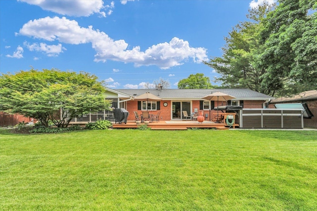 1207 W Kirby Ave, Champaign, IL 61821 - back of house with brick siding, a deck, a yard, and a swimming pool