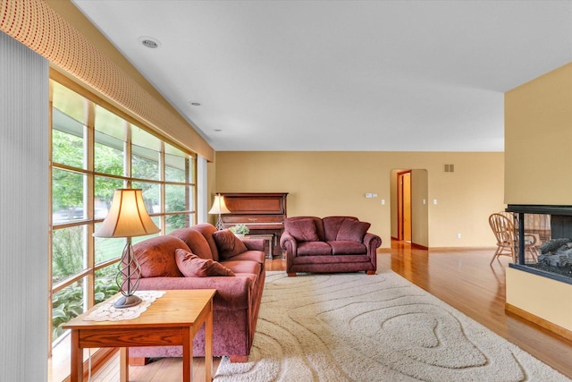 1207 W Kirby Ave, Champaign, IL 61821 - living area with wood finished floors and a multi sided fireplace