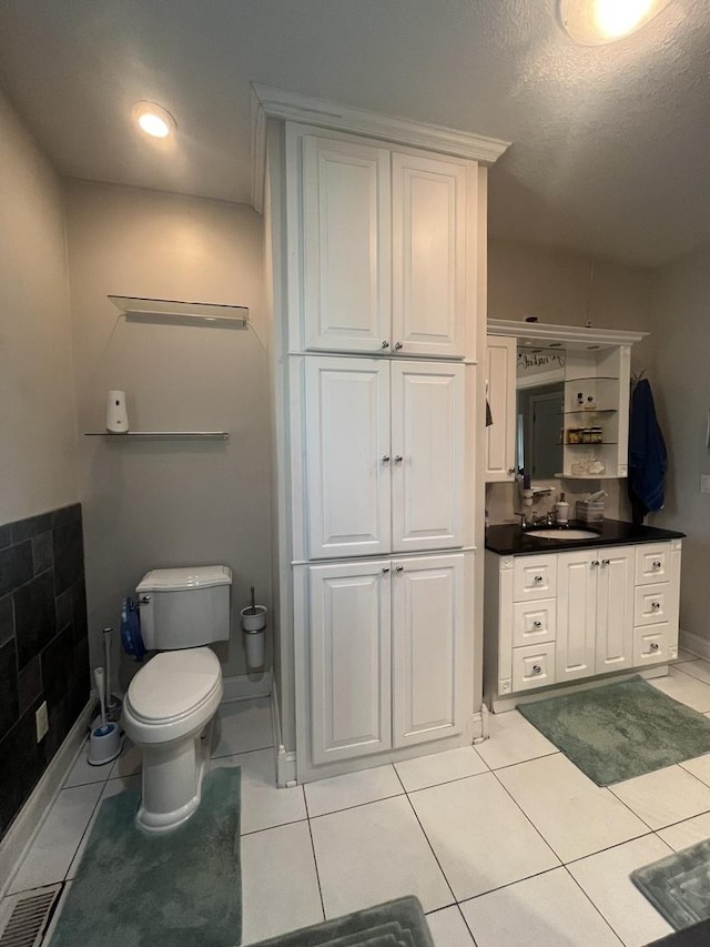 1131 S Nelson Ave, Kankakee, IL 60901 - bathroom with vanity, toilet, and tile patterned floors