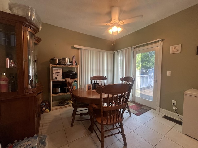 1131 S Nelson Ave, Kankakee, IL 60901 - dining room with light tile patterned flooring, a ceiling fan, and baseboards