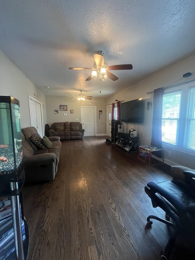 1131 S Nelson Ave, Kankakee, IL 60901 - living room featuring a textured ceiling, wood finished floors, a ceiling fan, and baseboards