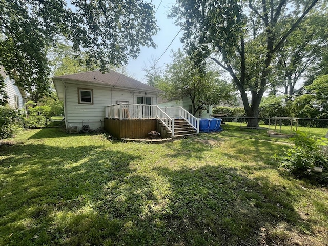 1131 S Nelson Ave, Kankakee, IL 60901 - rear view of property with a deck and a shingled roof