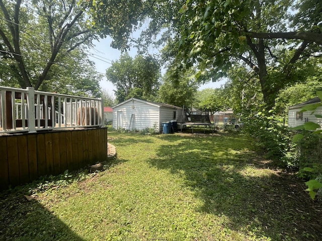 1131 S Nelson Ave, Kankakee, IL 60901 - view of grassy yard with a trampoline