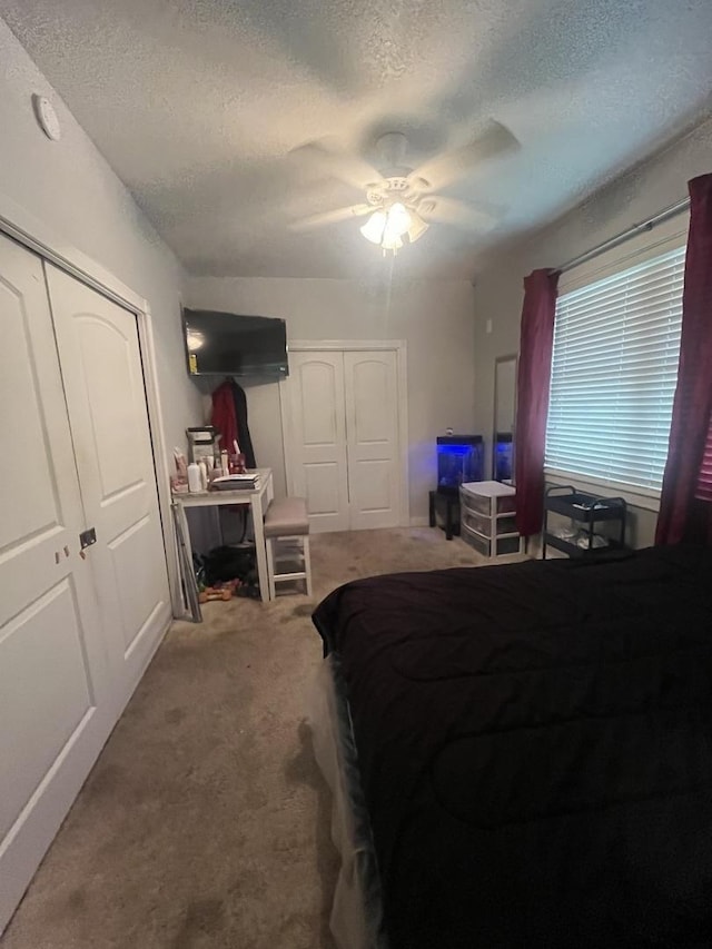 1131 S Nelson Ave, Kankakee, IL 60901 - bedroom with a textured ceiling, carpet flooring, and a ceiling fan