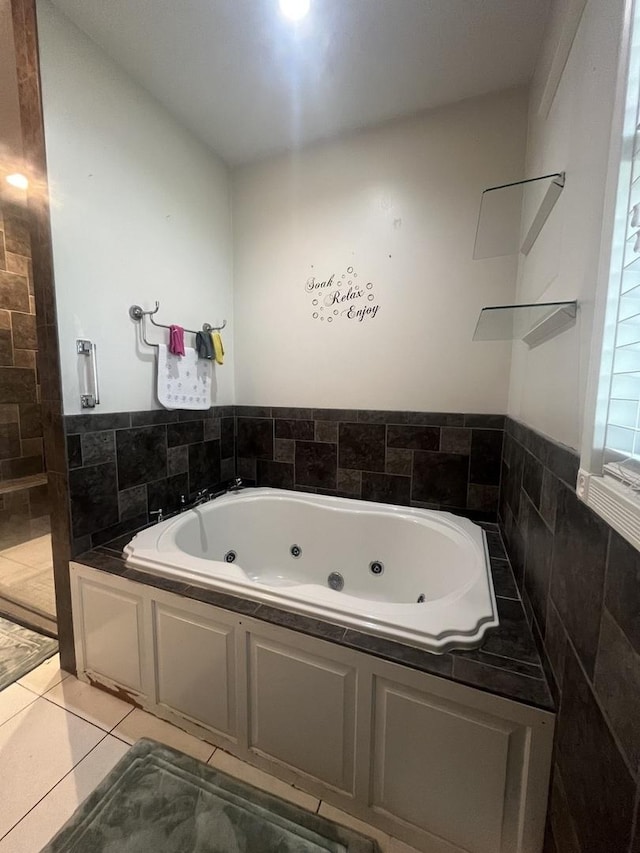 1131 S Nelson Ave, Kankakee, IL 60901 - bathroom featuring a whirlpool tub and tile patterned flooring