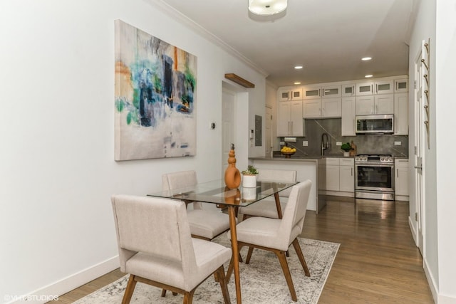 1346 S Wabash Ave Unit D, Chicago, IL 60605 - dining room featuring crown molding, wood finished floors, electric panel, recessed lighting, and baseboards