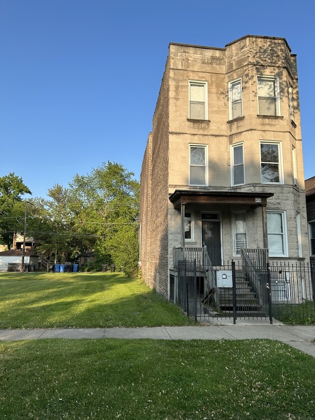 6409 S Rhodes Ave, Chicago, IL 60637 - view of front facade with a gate, stone siding, and a porch