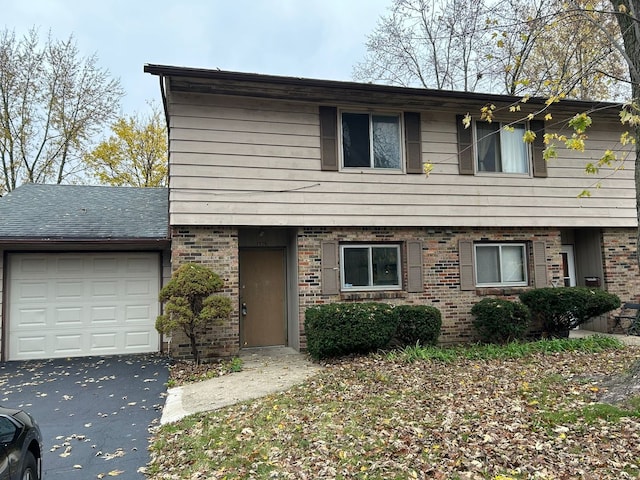 1927-29 W Illinois Ave, Aurora, IL 60506 - view of front of property with driveway, an attached garage, and brick siding