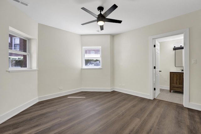 849 W Belle Plaine Ave Unit G, Chicago, IL 60613 - spare room with dark wood-type flooring, a ceiling fan, and baseboards
