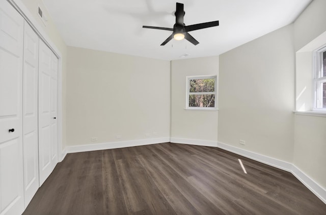 849 W Belle Plaine Ave Unit G, Chicago, IL 60613 - unfurnished bedroom with dark wood-type flooring, multiple windows, and baseboards