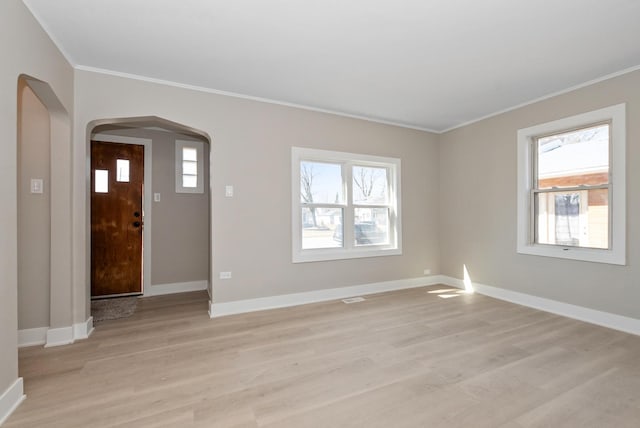9841 Cook Ave, Oak Lawn, IL 60453 - foyer with arched walkways, ornamental molding, light wood-style floors, and healthy amount of natural light