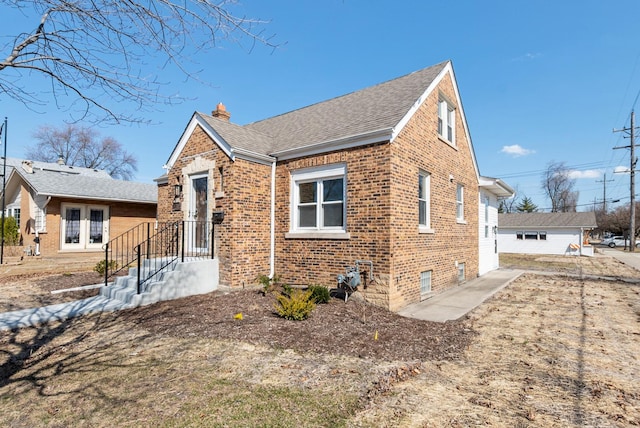 9841 Cook Ave, Oak Lawn, IL 60453 - view of front of property with brick siding, a chimney, and roof with shingles