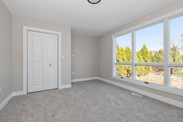 9841 Cook Ave, Oak Lawn, IL 60453 - unfurnished bedroom with carpet floors, multiple windows, and baseboards