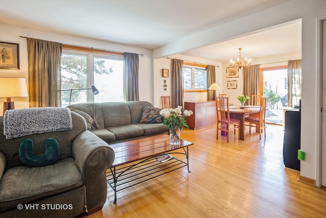 608 N Craig Pl, Addison, IL 60101 - living area featuring a chandelier, light wood finished floors, and beamed ceiling