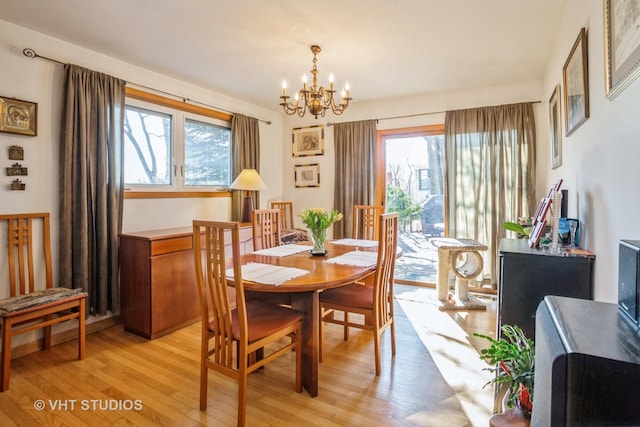 608 N Craig Pl, Addison, IL 60101 - dining room with a chandelier, healthy amount of natural light, and light wood-style flooring