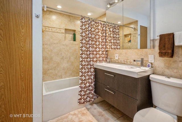 608 N Craig Pl, Addison, IL 60101 - bathroom with tile walls, toilet, vanity, tile patterned floors, and shower / tub combo with curtain